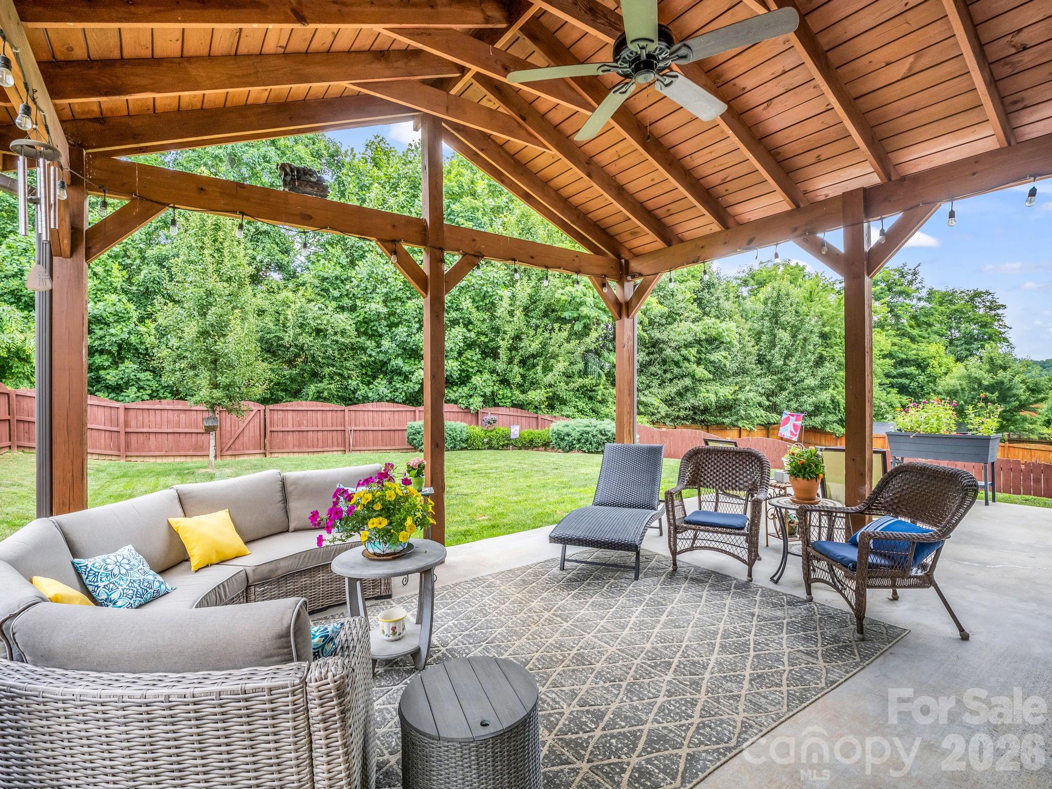 Enjoy the covered patio throughout the seasons. - 8 Mallard Run Drive, Arden