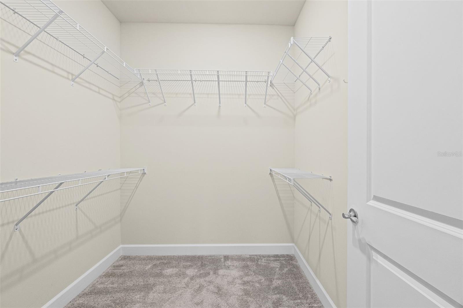 Primary walk in closet - 17726 NORTHWOOD PL, BRADENTON