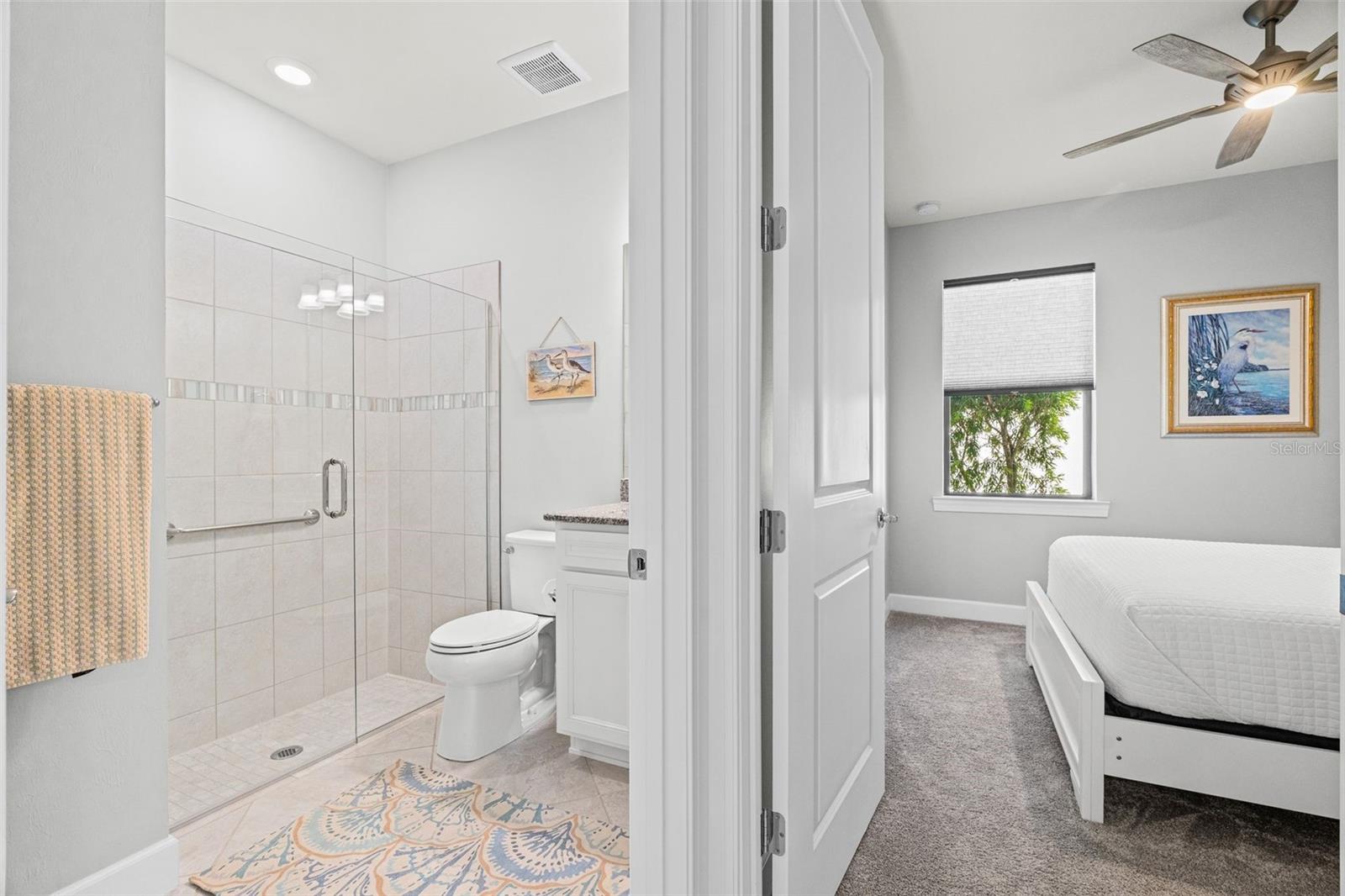 Guest bathroom and bedroom view - 17726 NORTHWOOD PL, BRADENTON