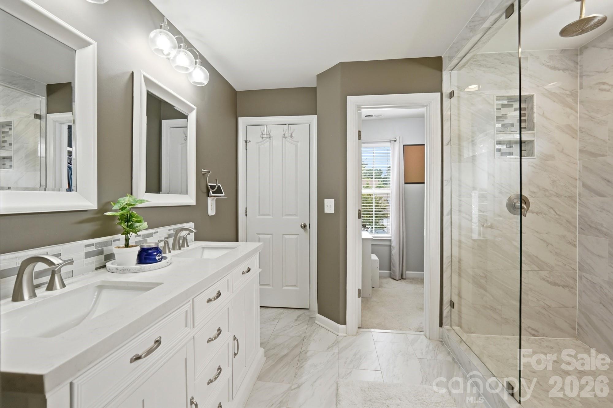 heated floors, large double-head shower, double vaniety - 2616 Sierra Chase Drive, Monroe