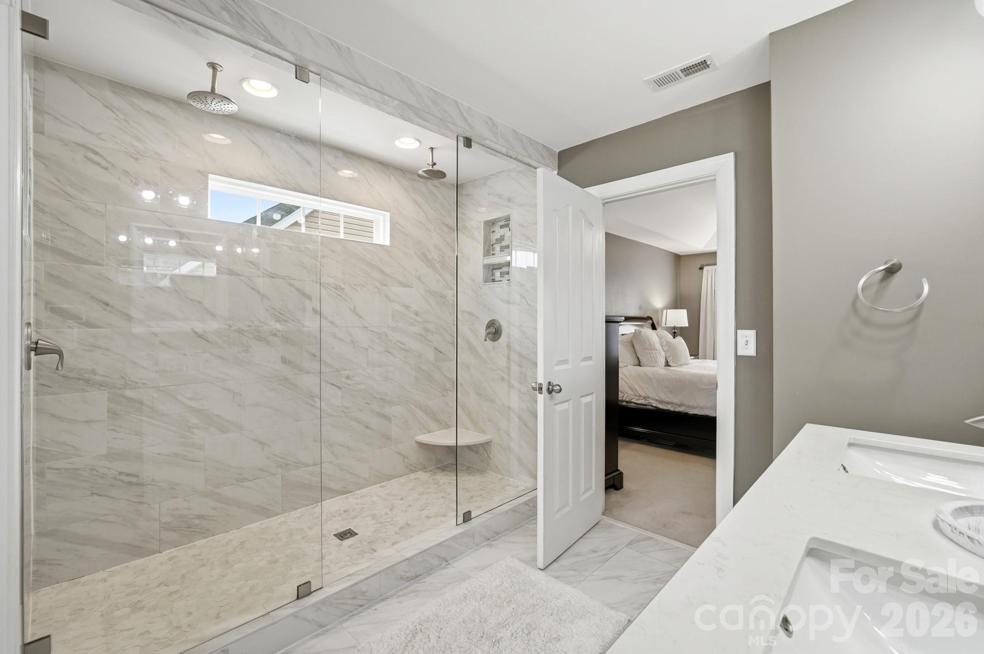 heated floors, large double-head shower, double vaniety - 2616 Sierra Chase Drive, Monroe