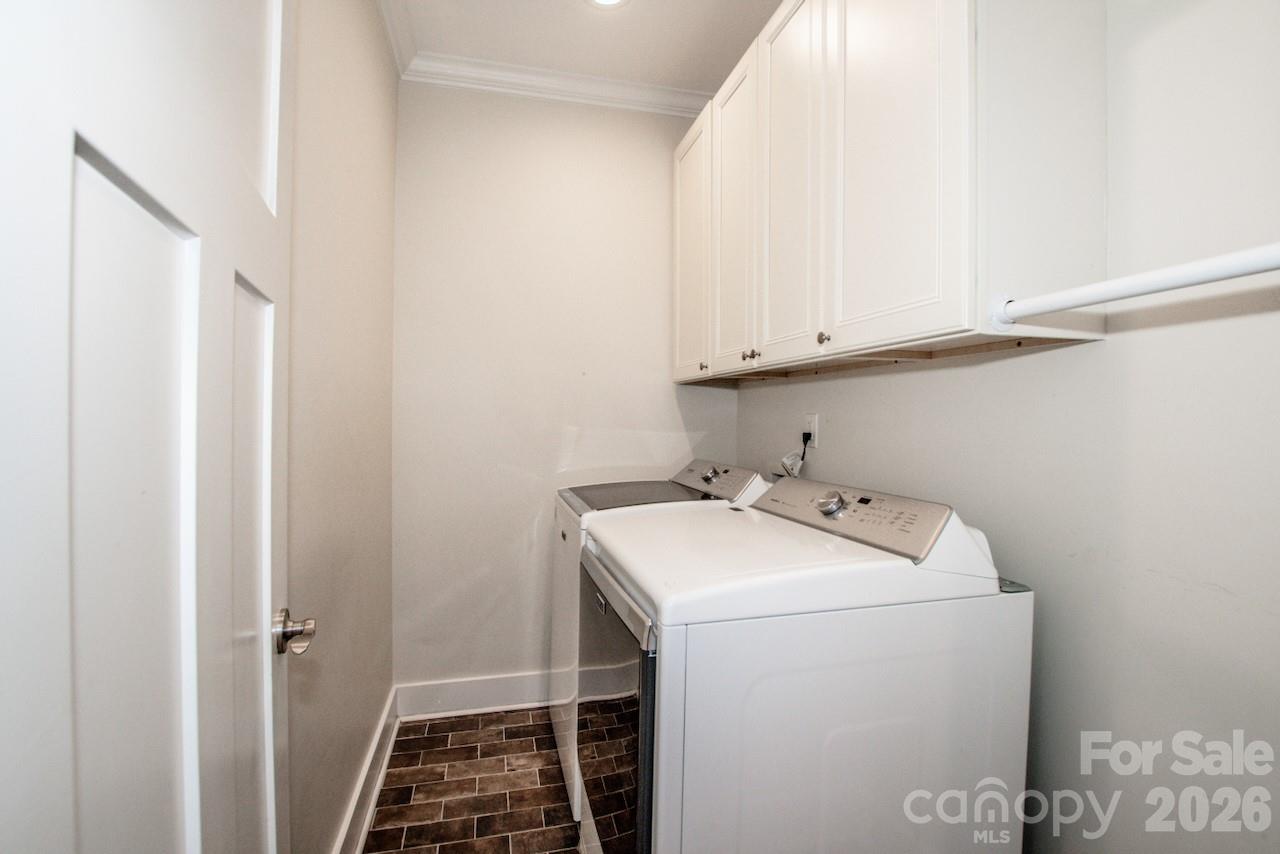 Laundry with custom cabinets on main - 155 Wood Acre Drive, Mooresville