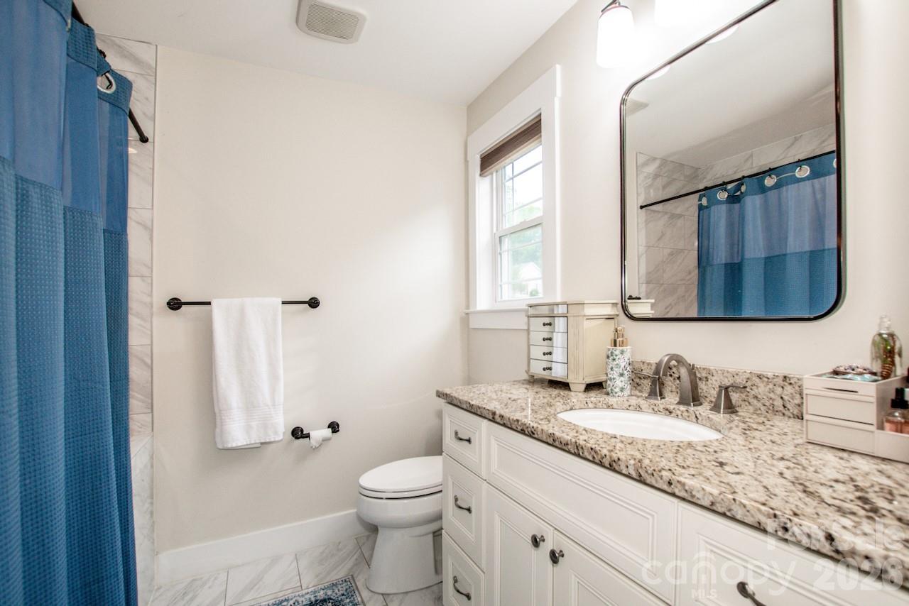 Tile and granite in both upstairs bathrooms - 155 Wood Acre Drive, Mooresville