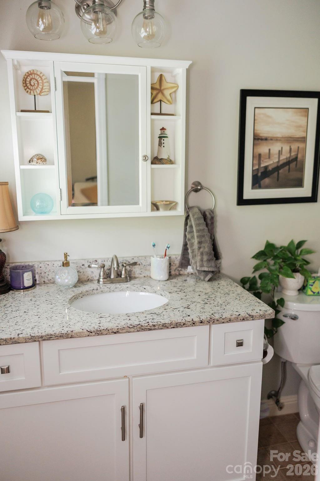 Bathroom 3 with granite counter tops and tile shower walls - 119 Country Meadow Lane, Kings Mountain