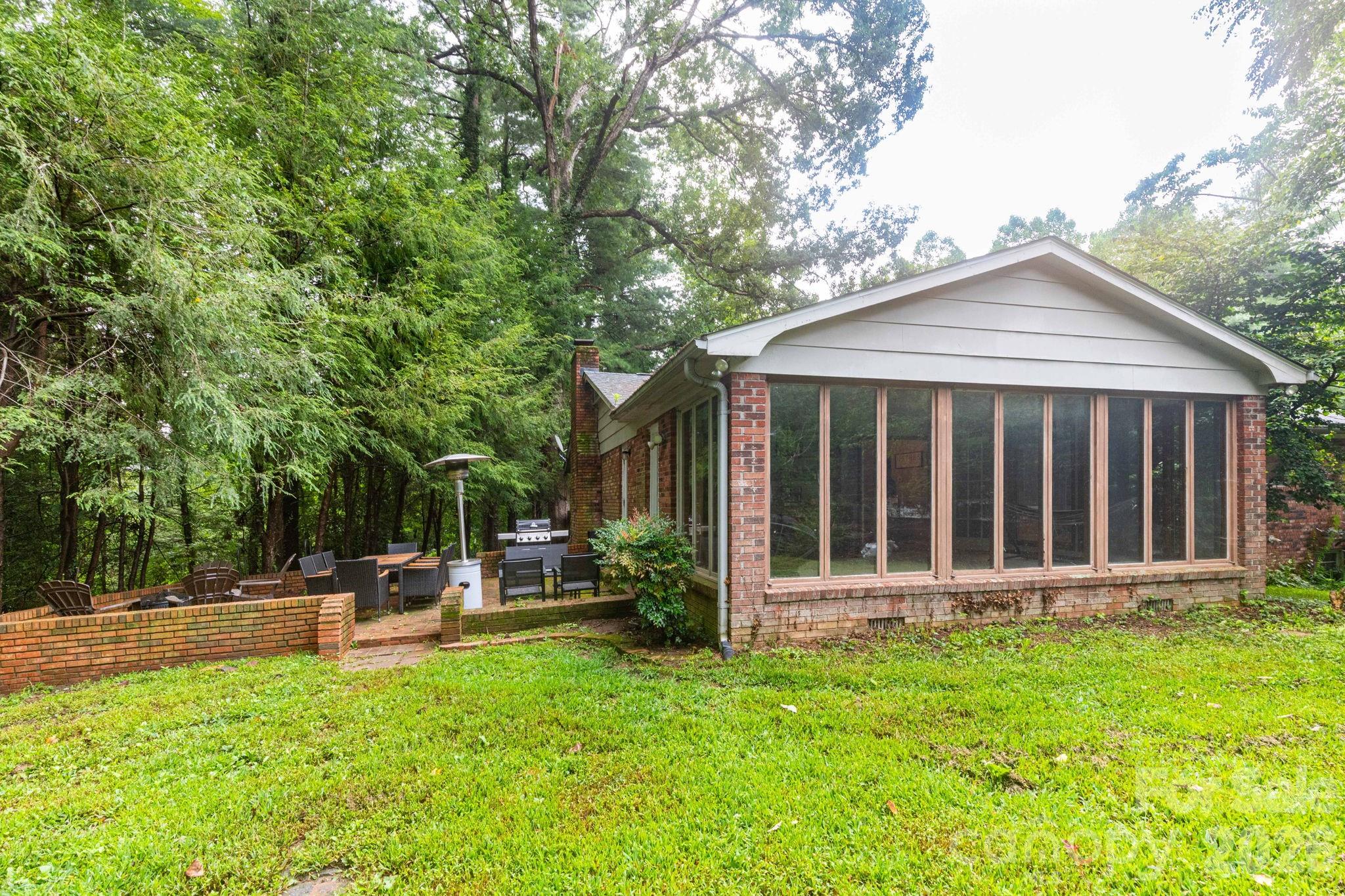 Backyard with Brick Patio. Perfect for grilling! - 936 Toxaway Drive, Hendersonville