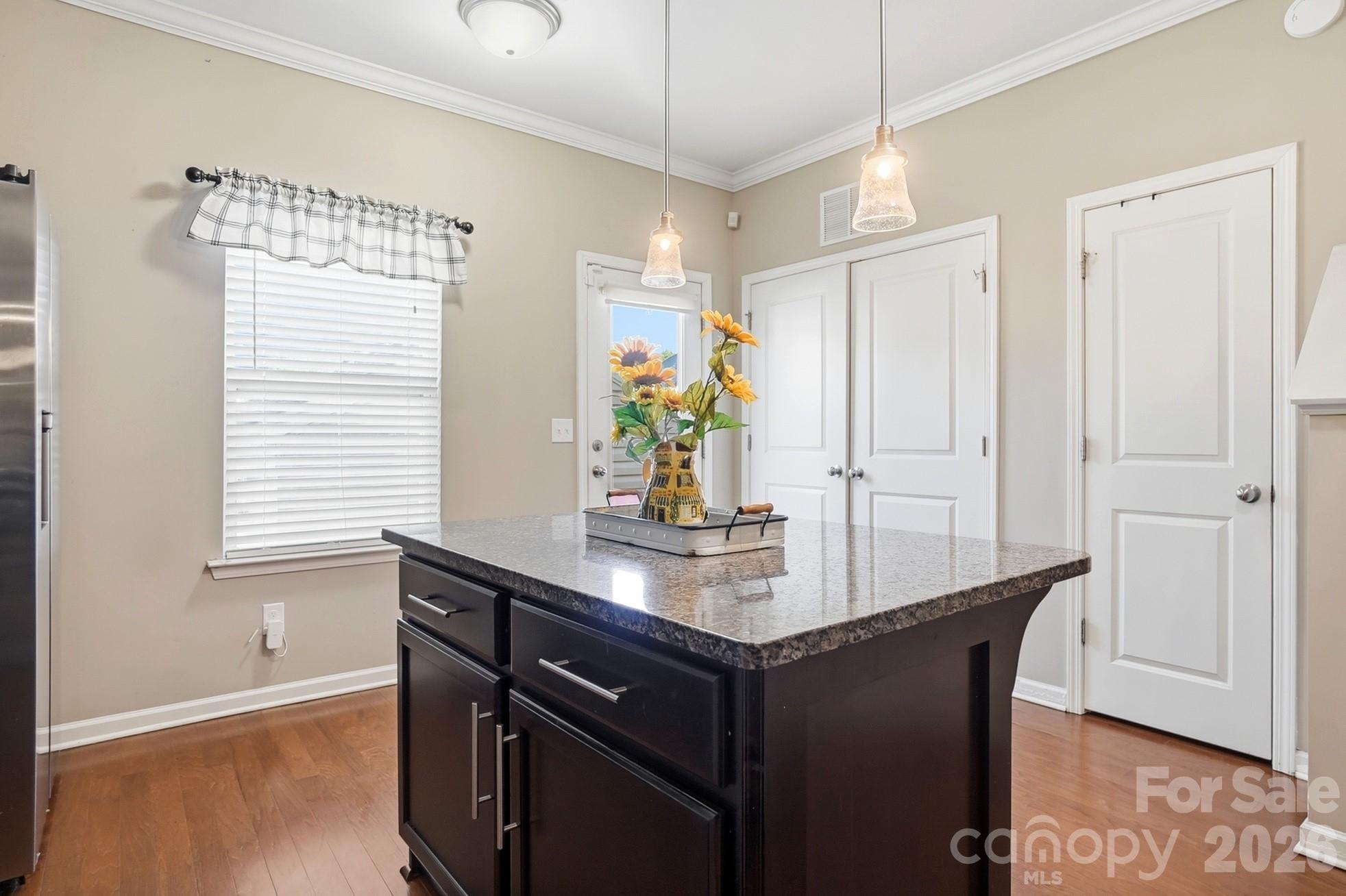 Center island adds extra prep space, storage and casual seating. - 11608 Galashiels Drive, Huntersville