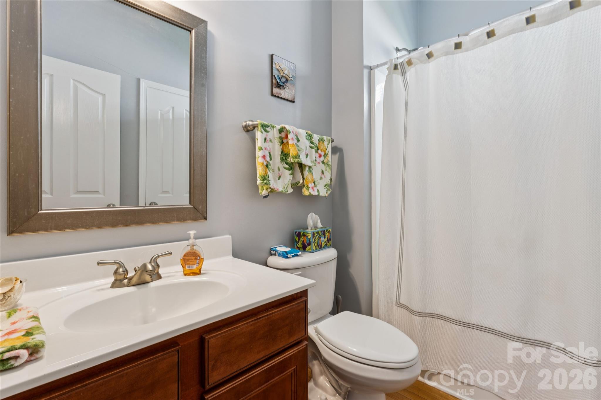 Main level full bath. Adjoins Bedroom #2 - 8108 Penman Springs Drive, Waxhaw