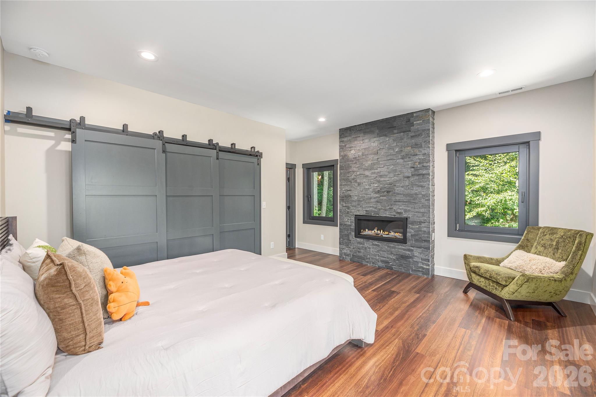 Primary suite with contemporary gas fireplace - 28 & 30 Garren View Drive, Fairview