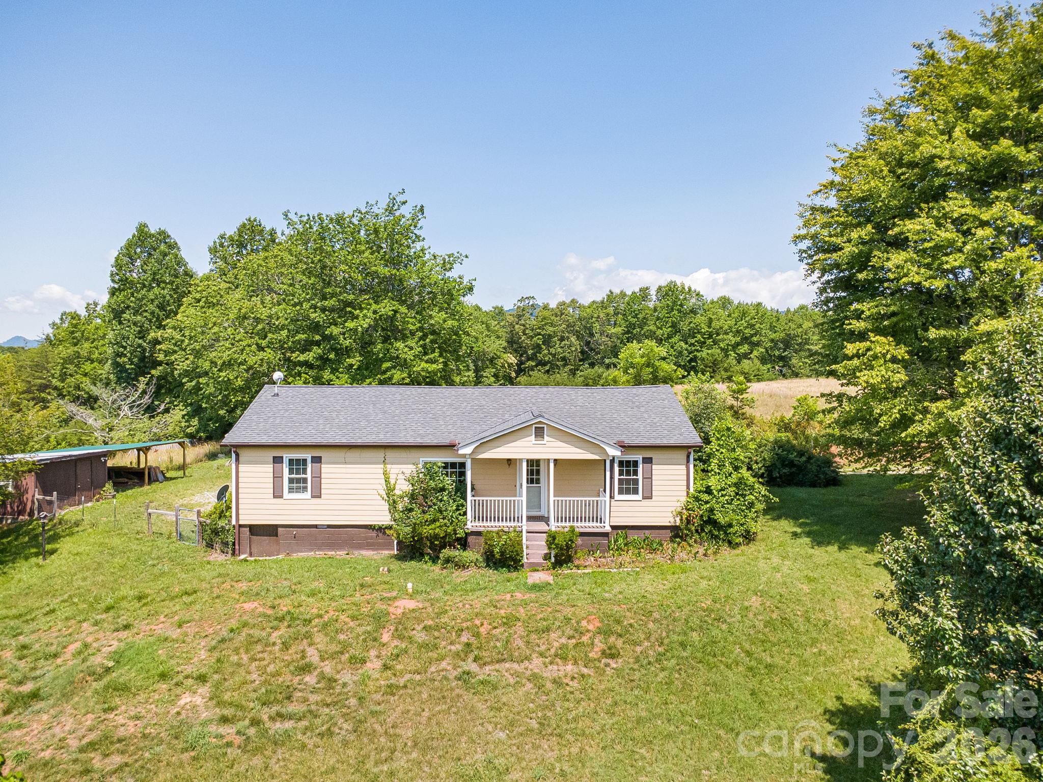 Front of house looking out at large yard. - 111 Bible School Road, Lake Lure