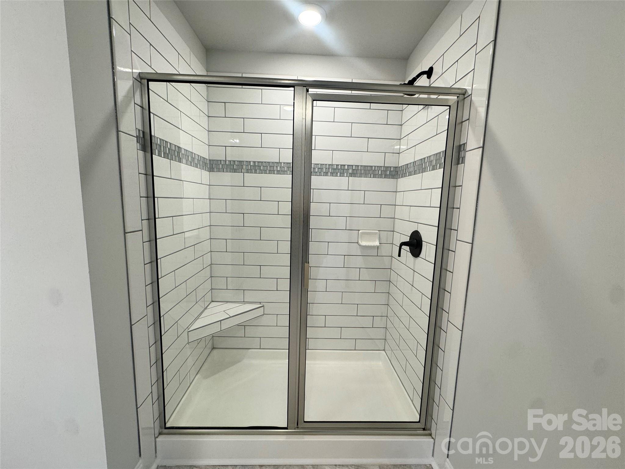 Ceramic tiled shower Representative Photo - 712 Inwood Hill Drive, Gastonia