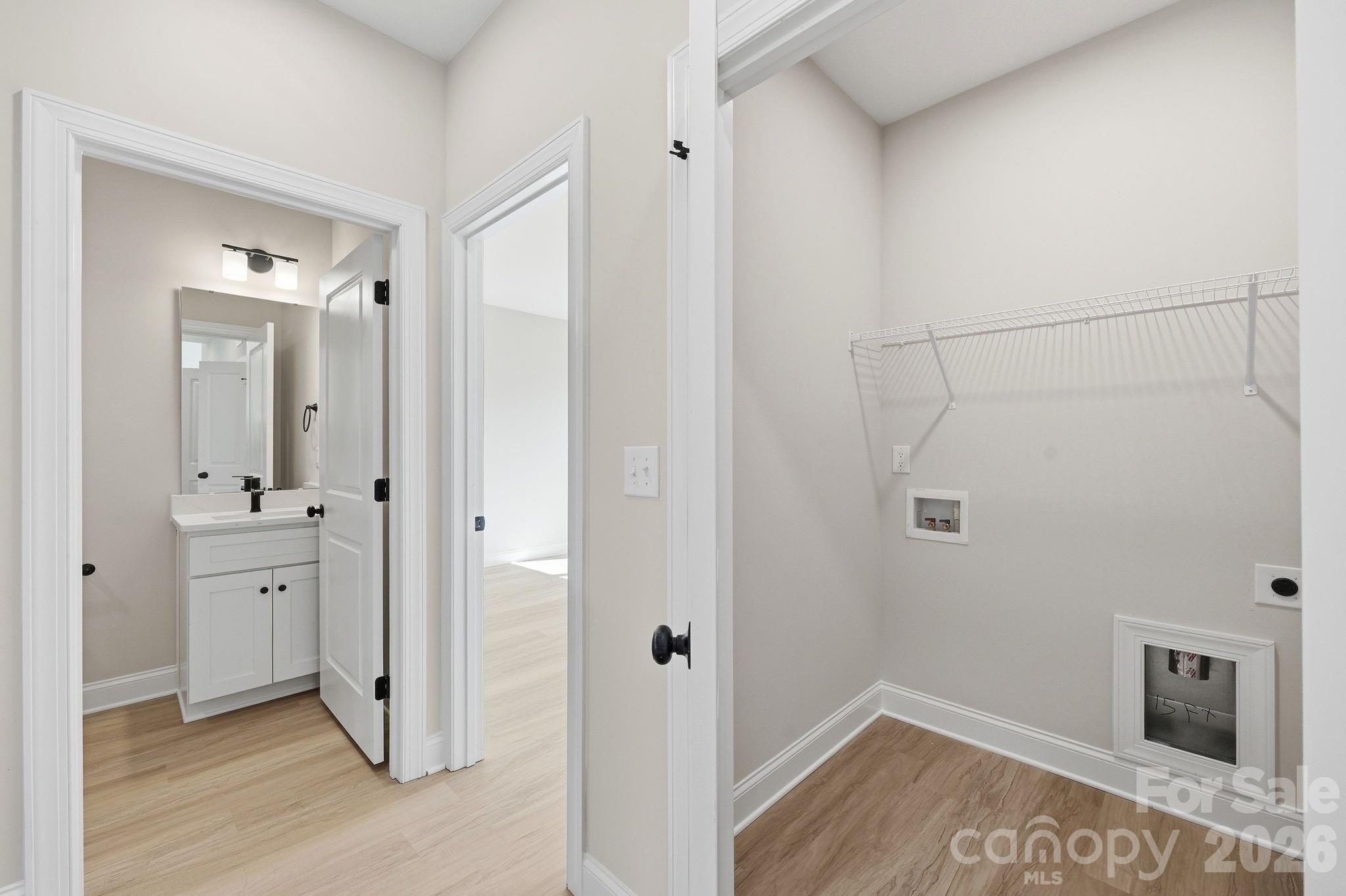 View from hall; Laundry and secondary bathroom - 1962 Redwood Drive, Oakboro