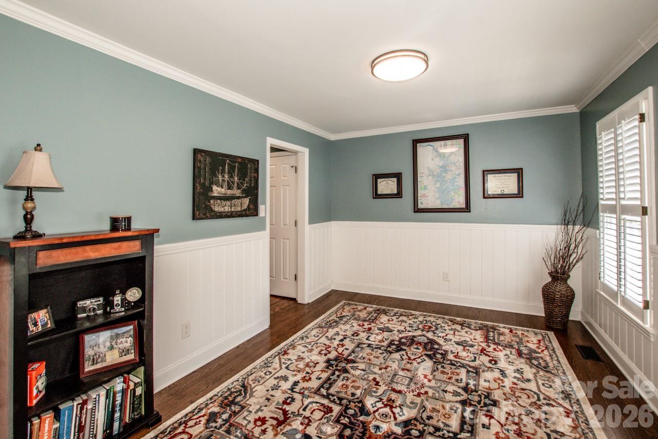 dining room has charming wainscoting and classic detailing. - 921 Argyle Court, Statesville