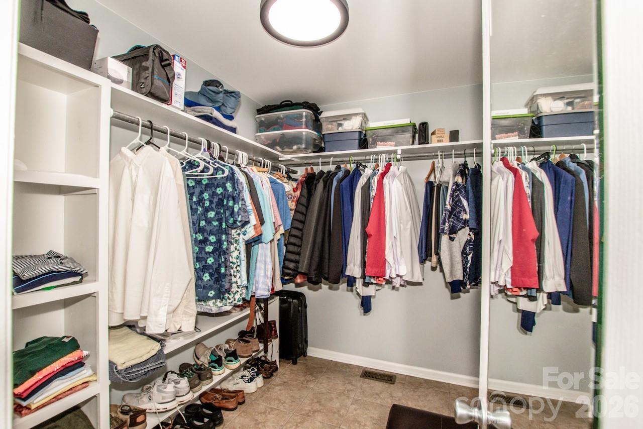 Primary closet has large floorlength mirror - 921 Argyle Court, Statesville
