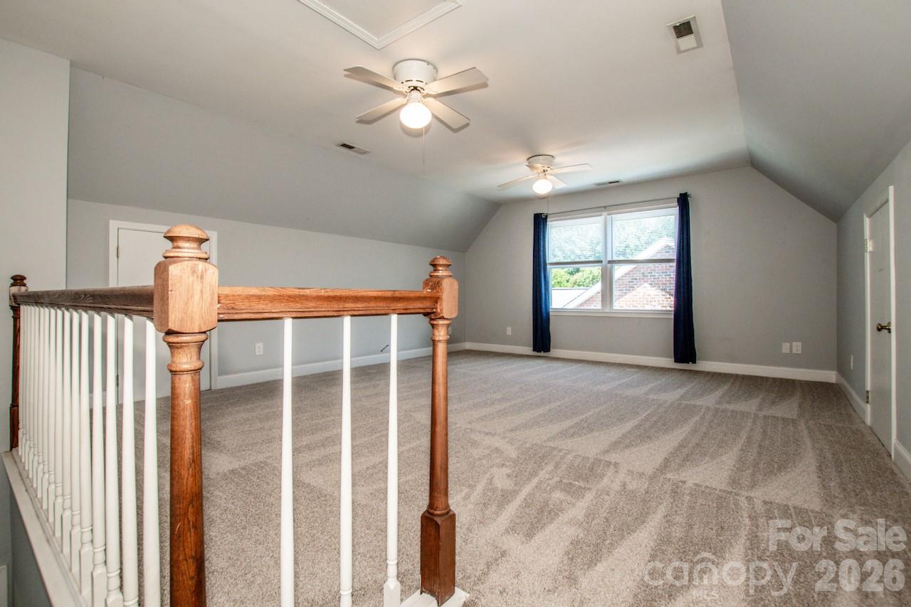 Bonus room door is across from powder room. - 921 Argyle Court, Statesville