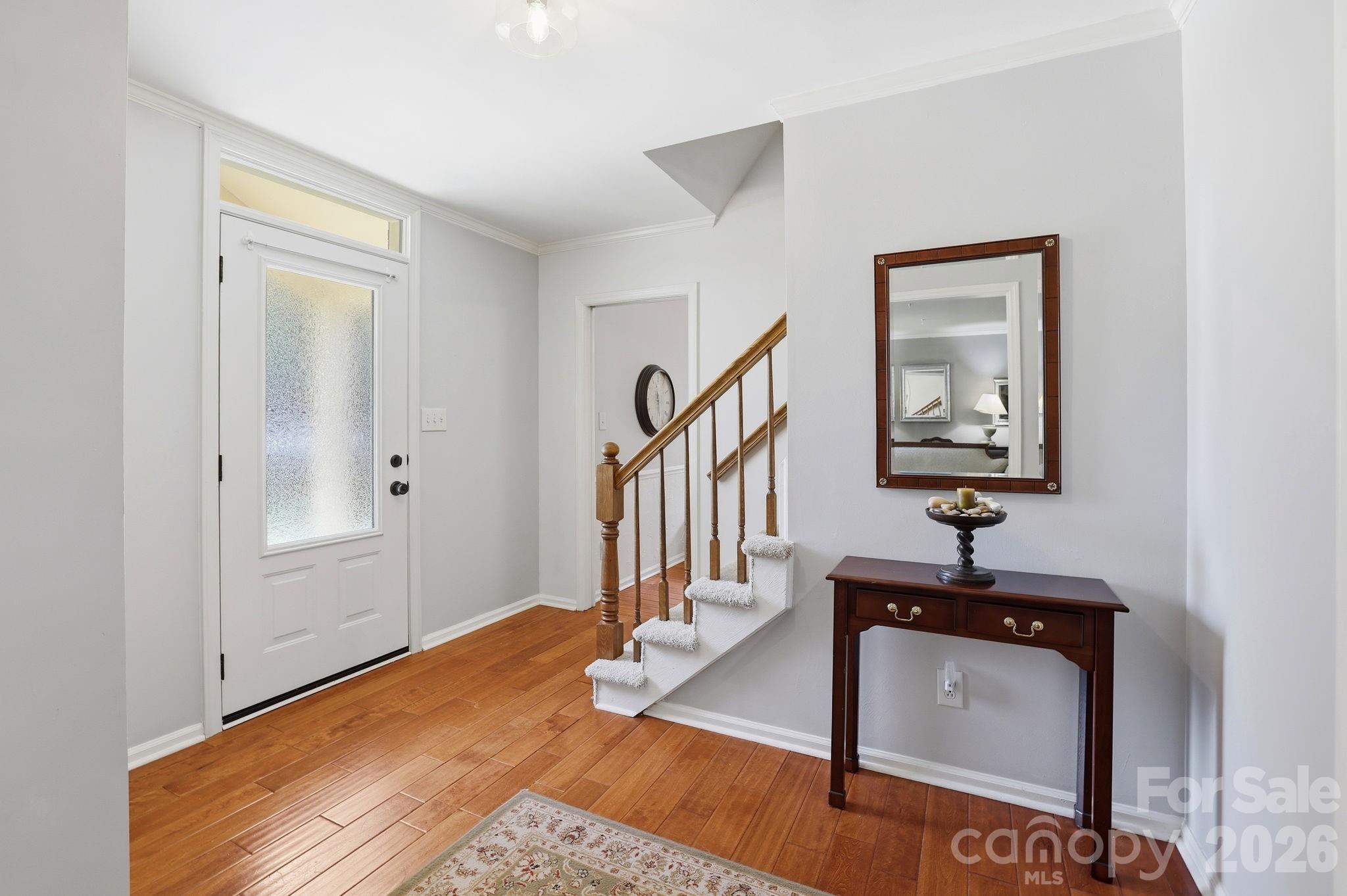 Foyer with coat closet, entrance to living room, den and kitchen340 Walnut Point DrMatthews, NC 28105Sardis Plantation - 340 Walnut Point Drive, Matthews