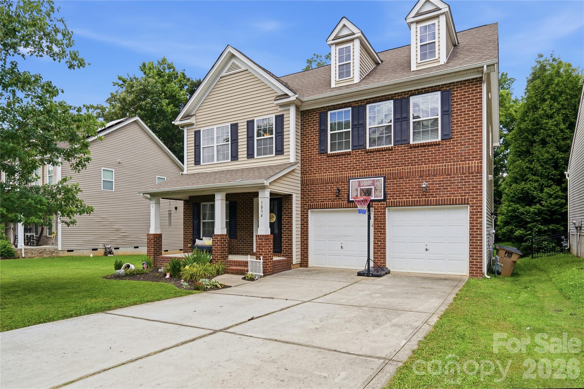 Handsome two-story brick-front home in the sought-after Brandon Oaks community - 1034 Canopy Drive, Indian Trail