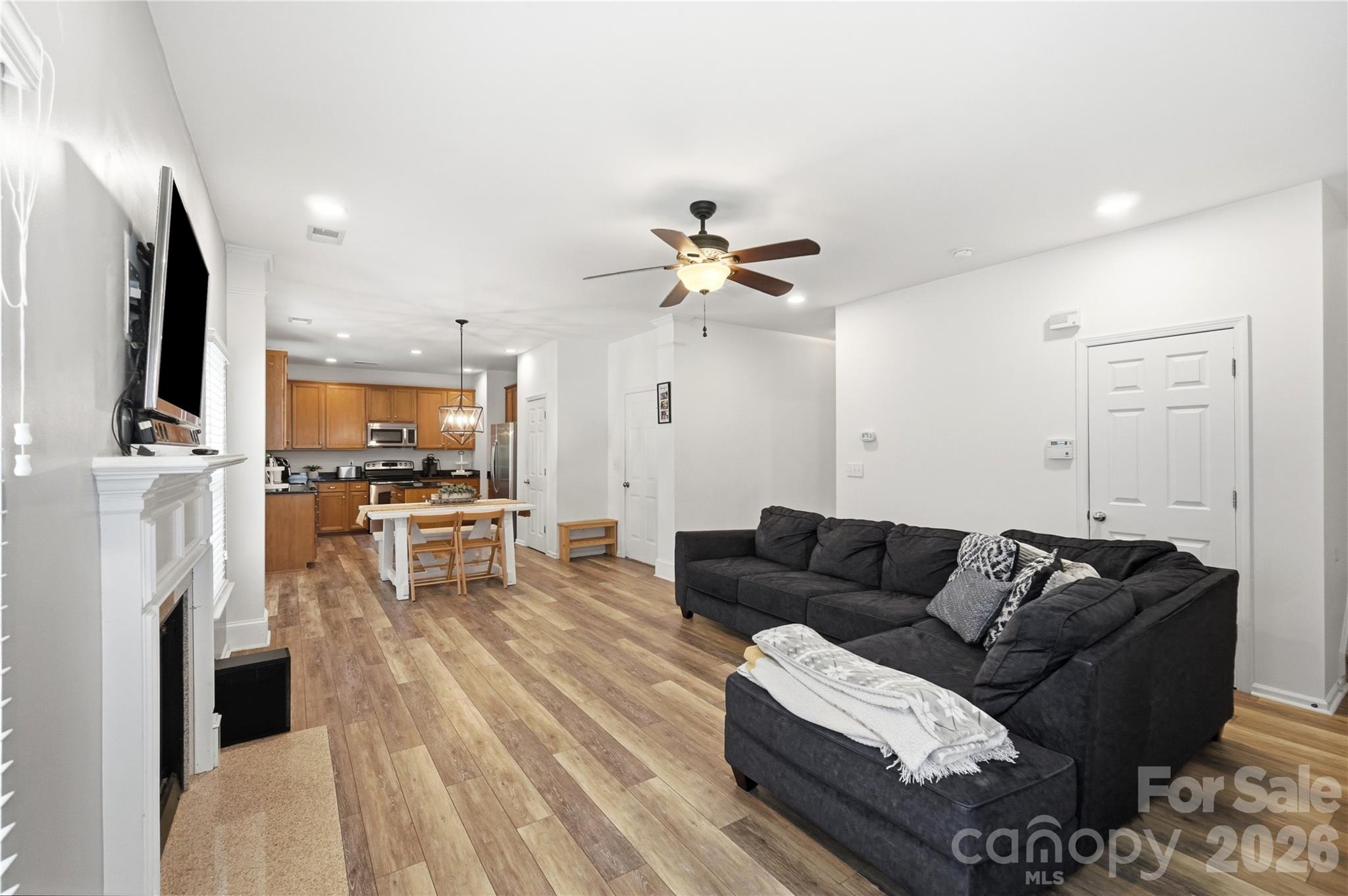 Open great room and kitchen designed for gathering and entertaining - 1034 Canopy Drive, Indian Trail