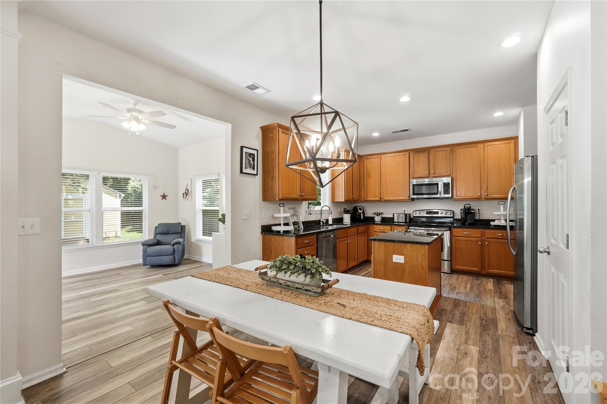 Spacious kitchen with a center island and pendant lighting - 1034 Canopy Drive, Indian Trail