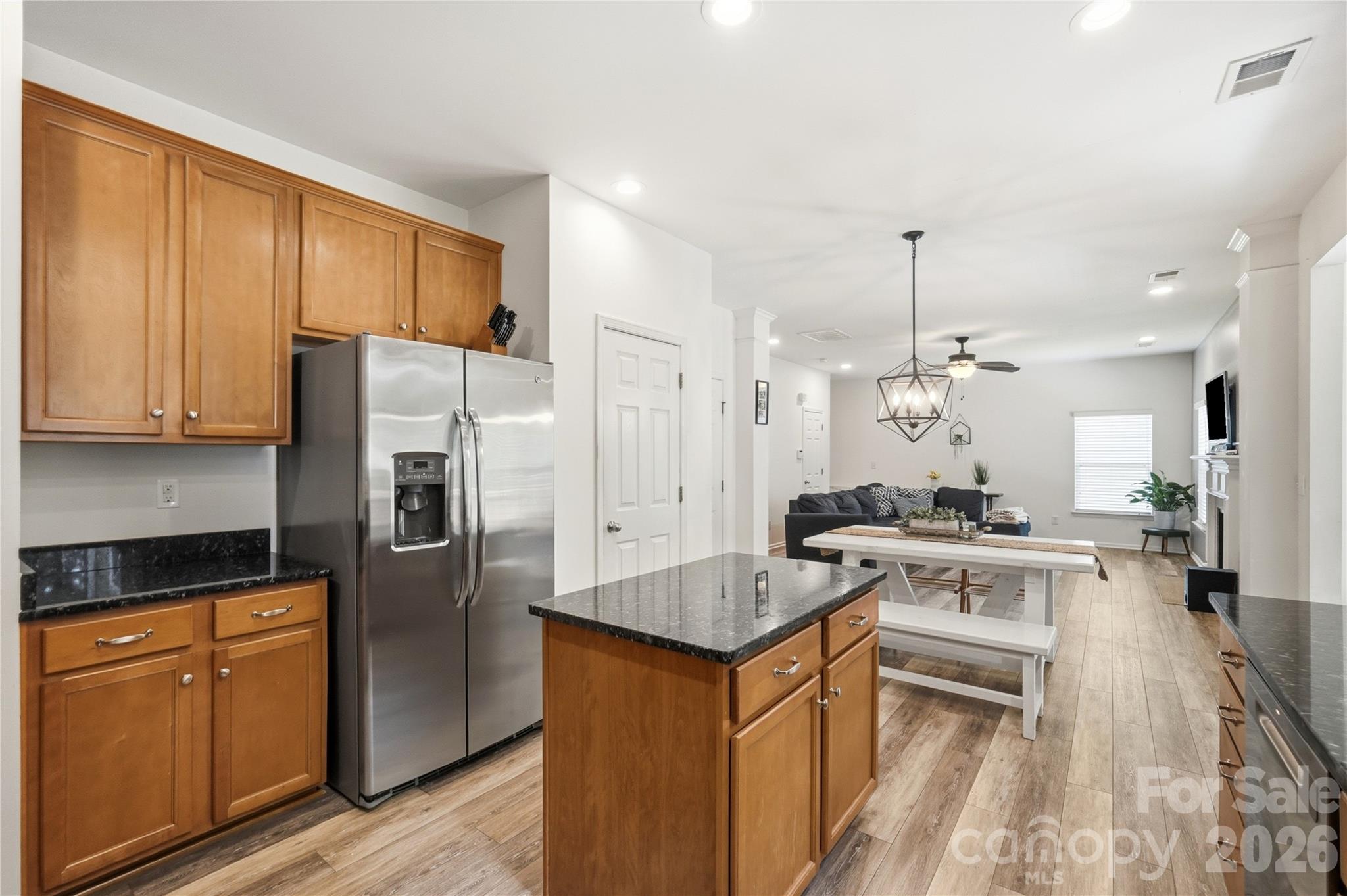 Open kitchen with generous counter space and breakfast seating - 1034 Canopy Drive, Indian Trail