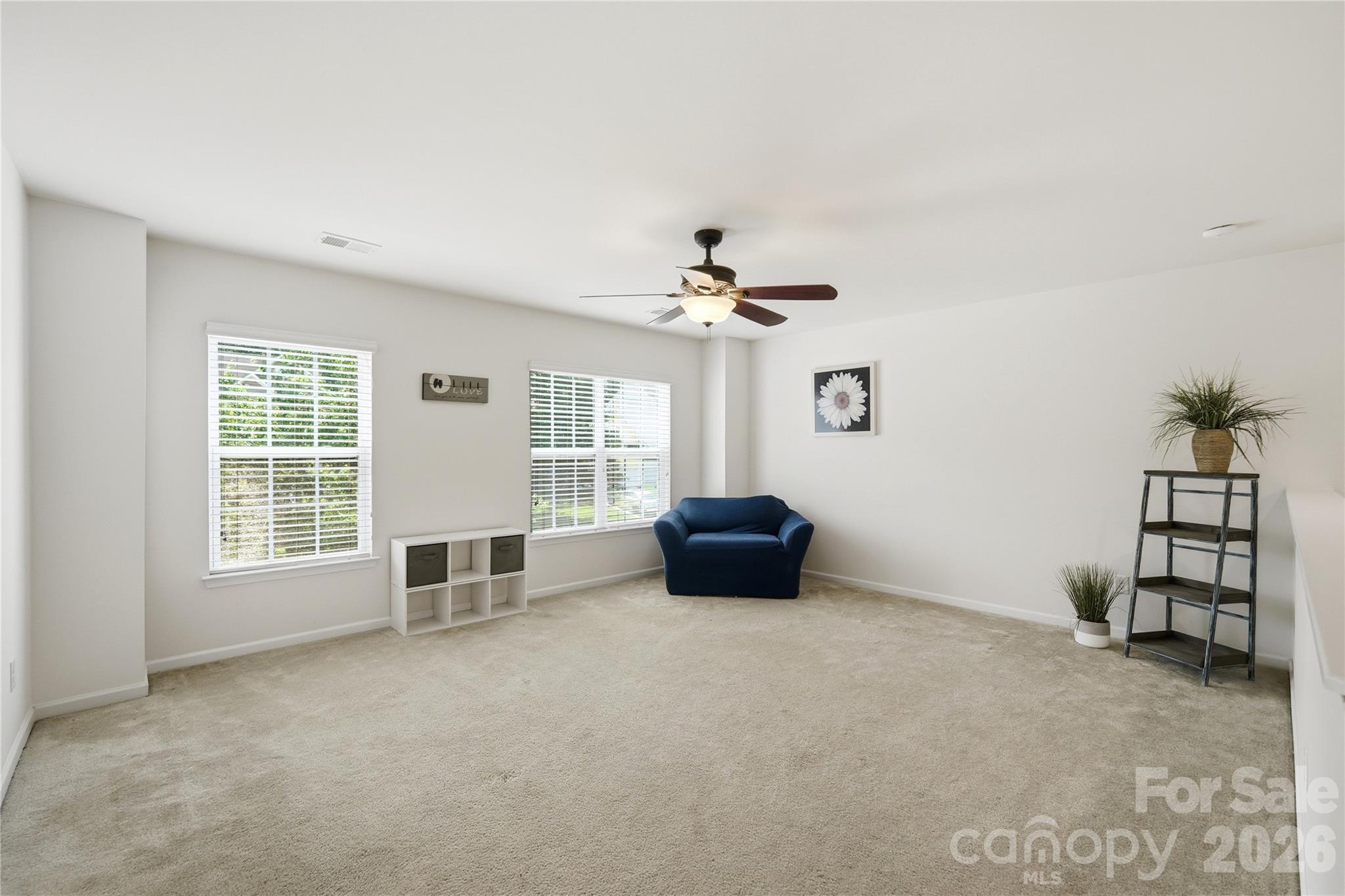 Versatile upstairs loft ready for a home office, playroom, or lounge - 1034 Canopy Drive, Indian Trail