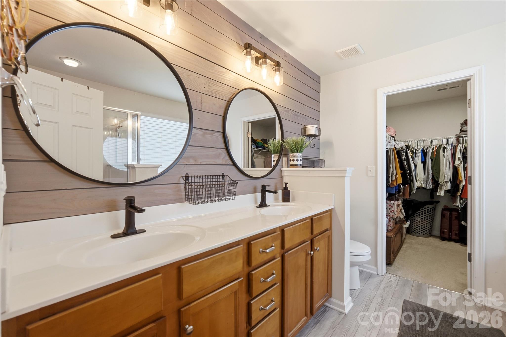 Spa-style primary bath with dual vanities - 1034 Canopy Drive, Indian Trail