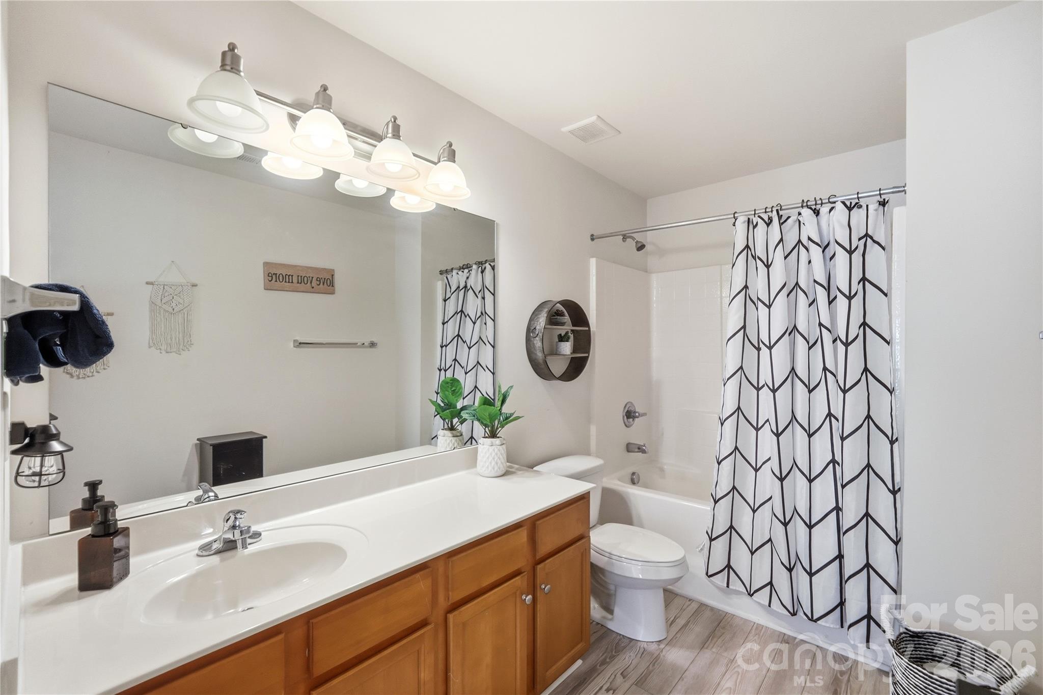 Full bath with a vanity and tub-shower combo - 1034 Canopy Drive, Indian Trail