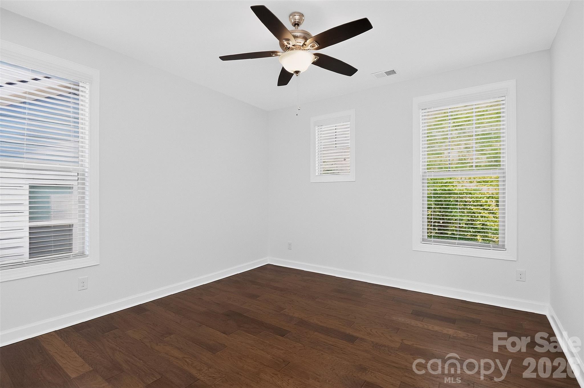 Bedroom 2 is off of the loft and features the same wood flooring. - 6071 Drave Lane, Fort Mill