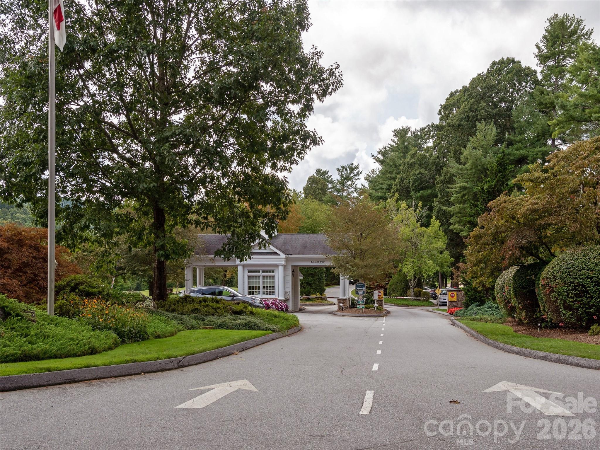 Security gate entry provides controlled access and added peace of mind within the community. - 128 Pinnacle Peak Lane, Flat Rock