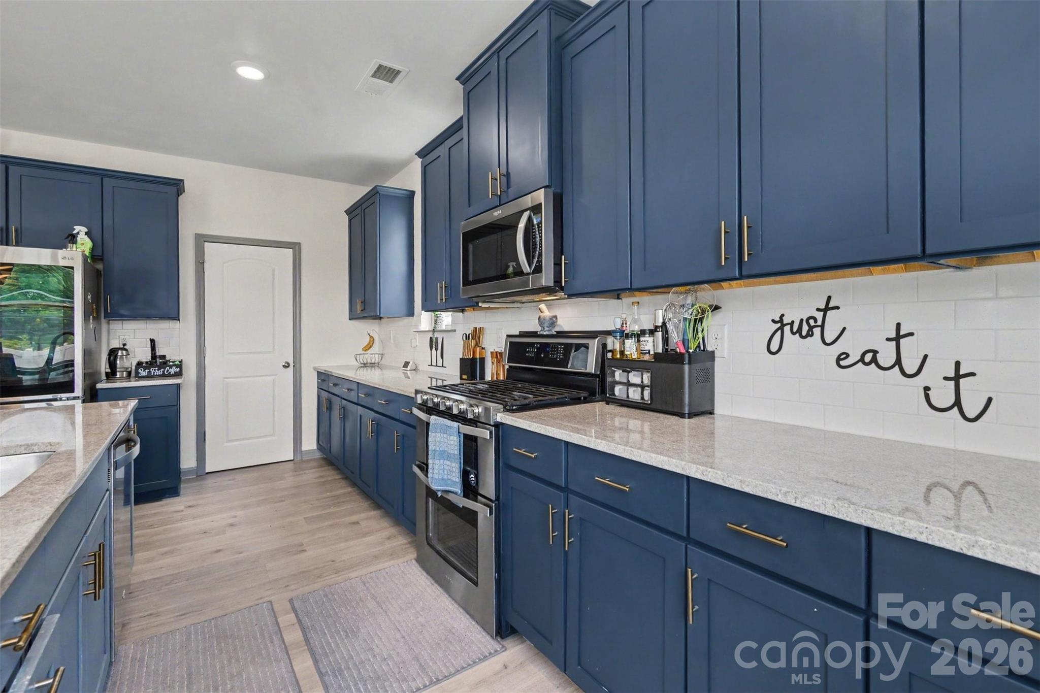 Picture yourself creating culinary masterpieces on these copious countertops? - 2055 Yearden Lane, Monroe