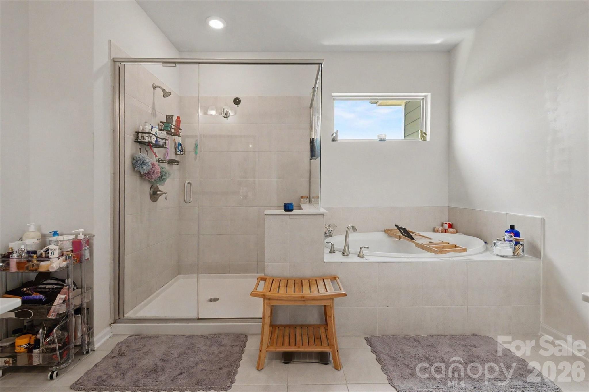 The primary bath also features a large, tiled shower and separate garden tub. - 2055 Yearden Lane, Monroe