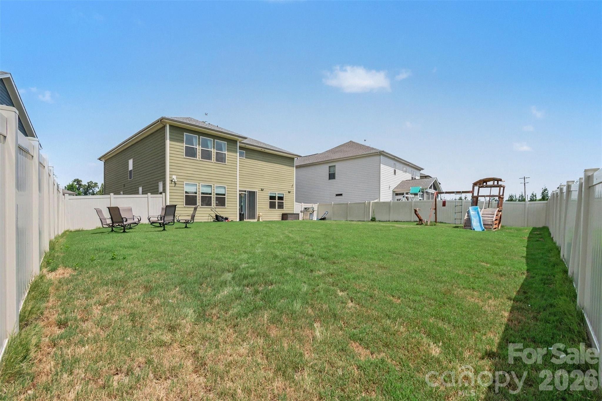 This giant, fully fenced back yard is perfect for play or anything your heart desires! - 2055 Yearden Lane, Monroe