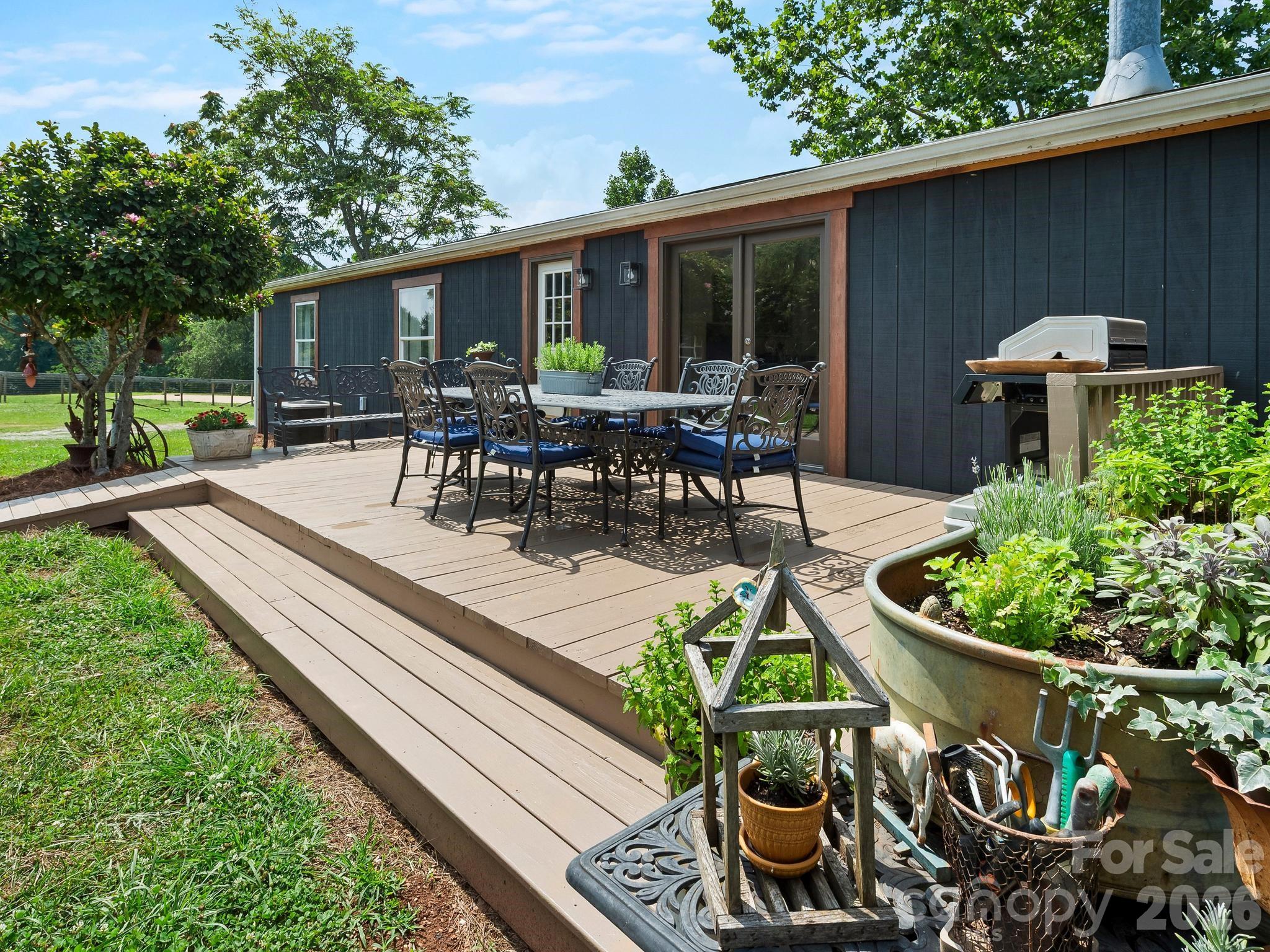 Rear deck has plenty of room for dining and grilling - 1541 Sandy Springs Road, Rutherfordton