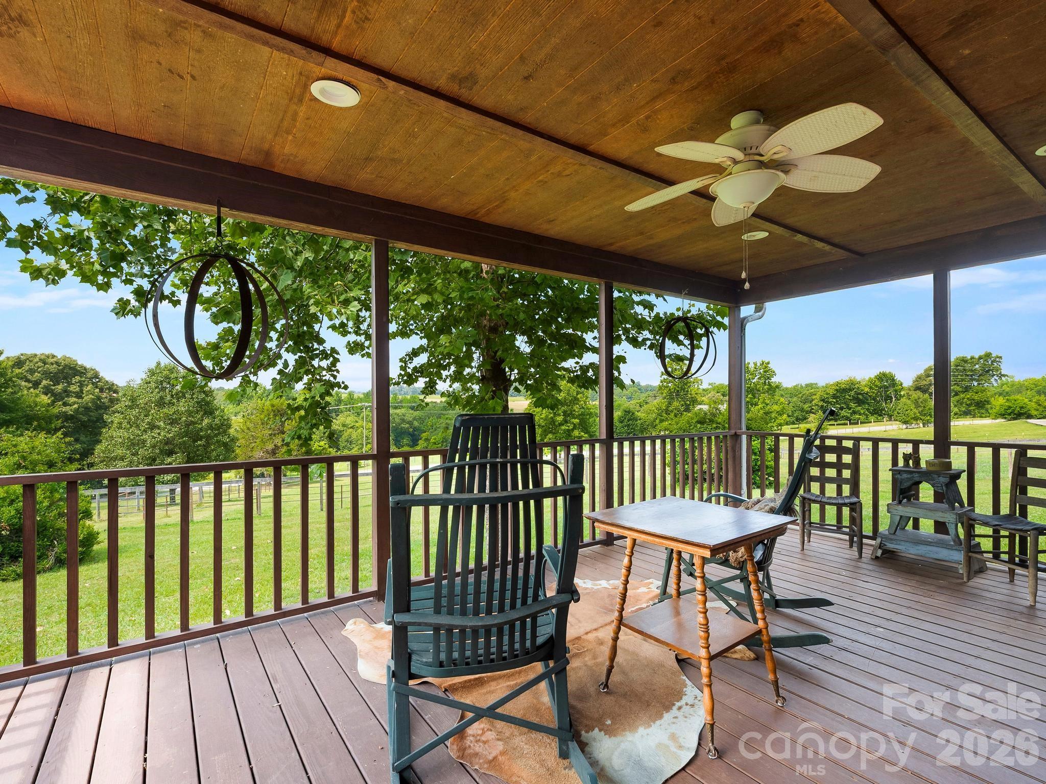 The front porch was built for sitting under the fan looking out at the pastoral views - 1541 Sandy Springs Road, Rutherfordton