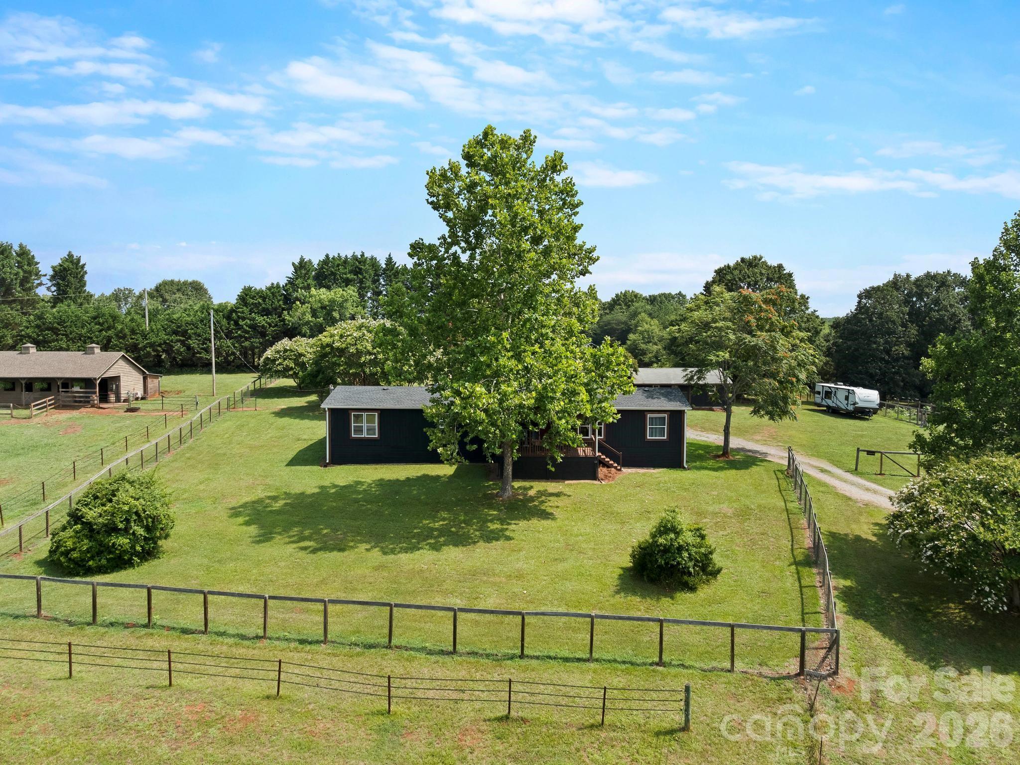The large area around the house is fenced for dogs with a gate on the driveway. - 1541 Sandy Springs Road, Rutherfordton