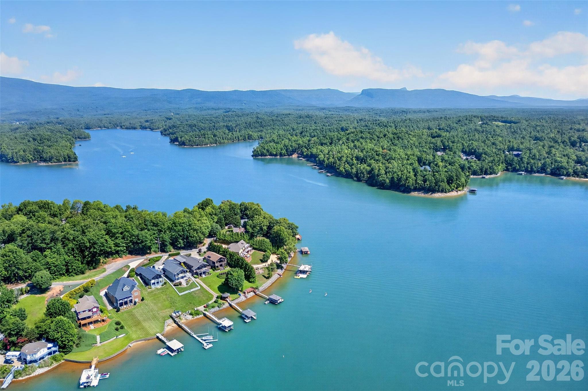 Aerial from the main channel showing waterfront homes and private docks along Lake James. - 831 Lake Club Drive, Nebo