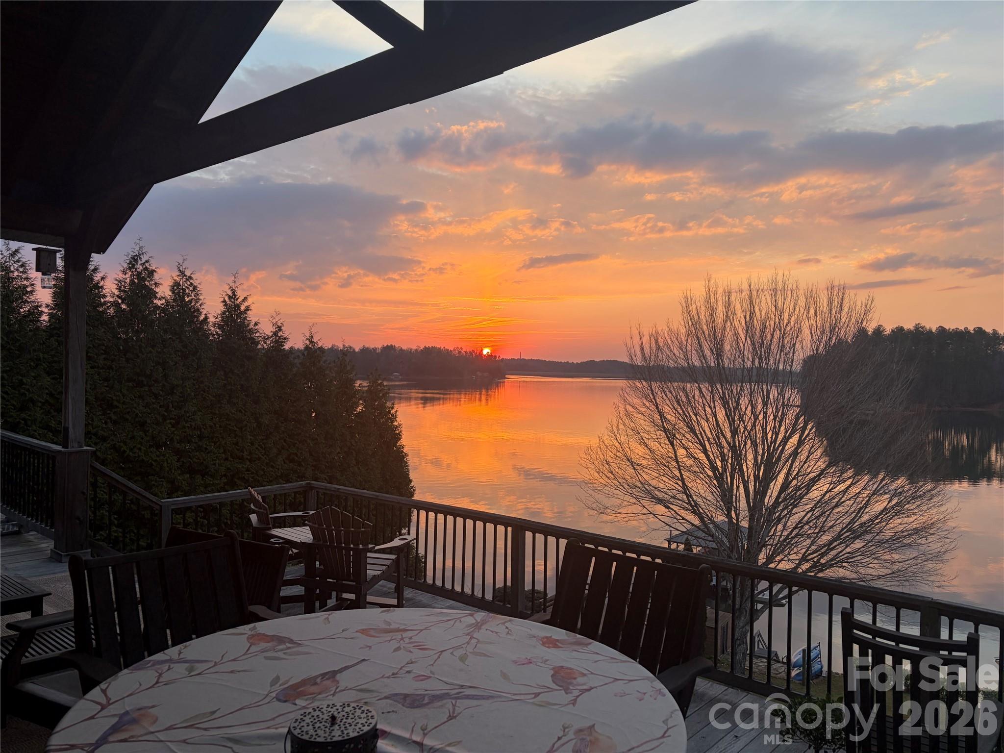 Aerial across Lake James toward the Blue Ridge, showing the year-round mountain and water view. - 831 Lake Club Drive, Nebo