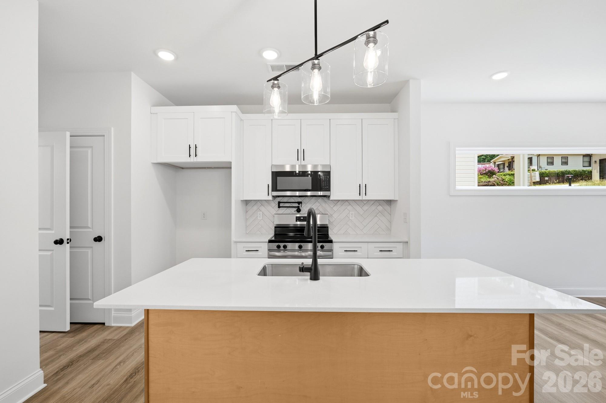 View of Kitchen with Kitchen Island Breakfast Bar - 116 7th Avenue SE, Hickory
