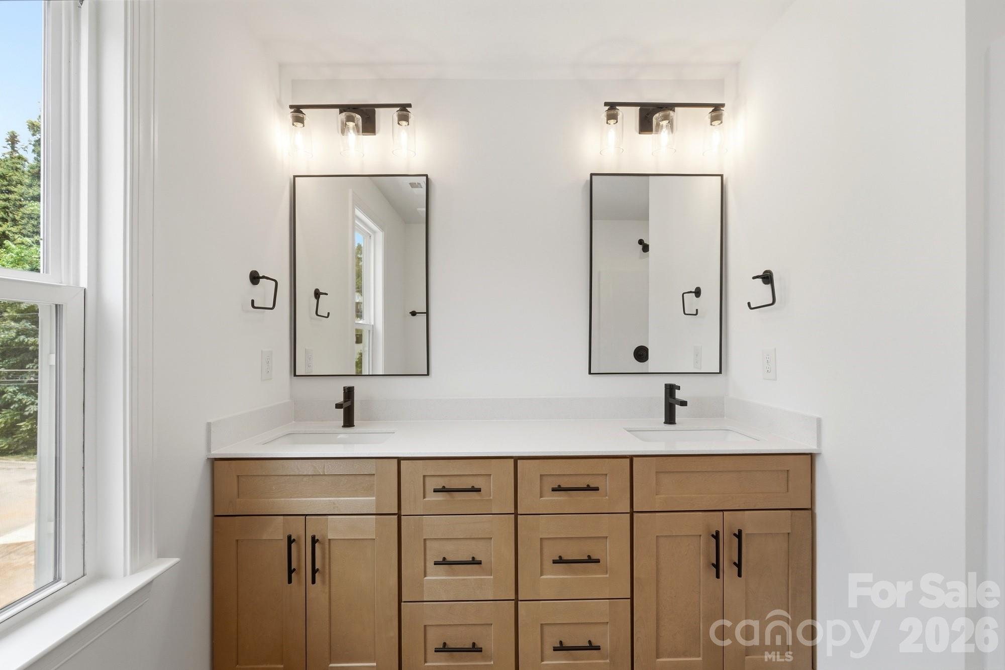 Dual Sinks & Mirrors in the Primary Bathroom - 116 7th Avenue SE, Hickory