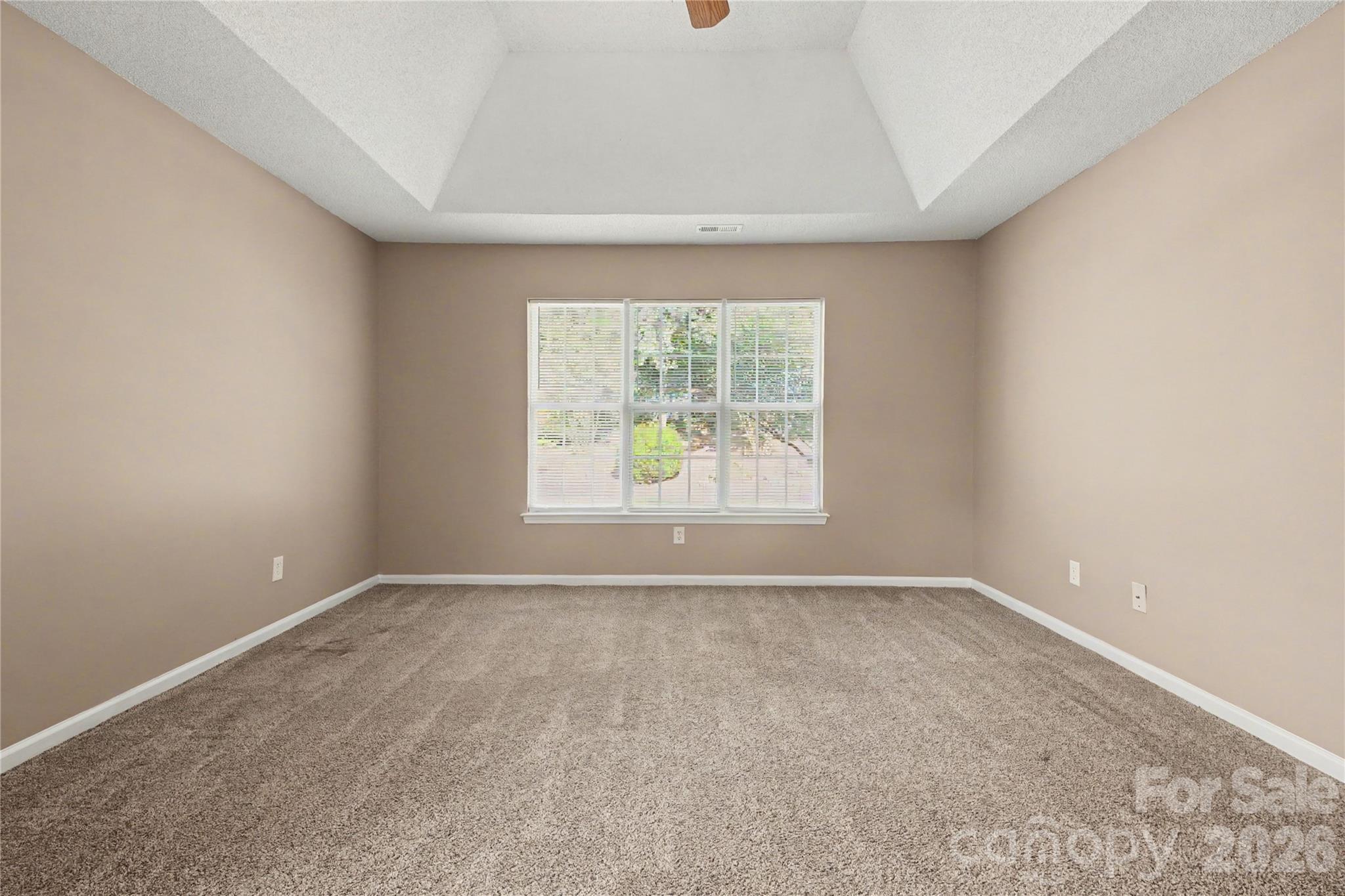 Primary bedroom with trey ceiling and fan - 3786 Sedgewick Street SW, Concord