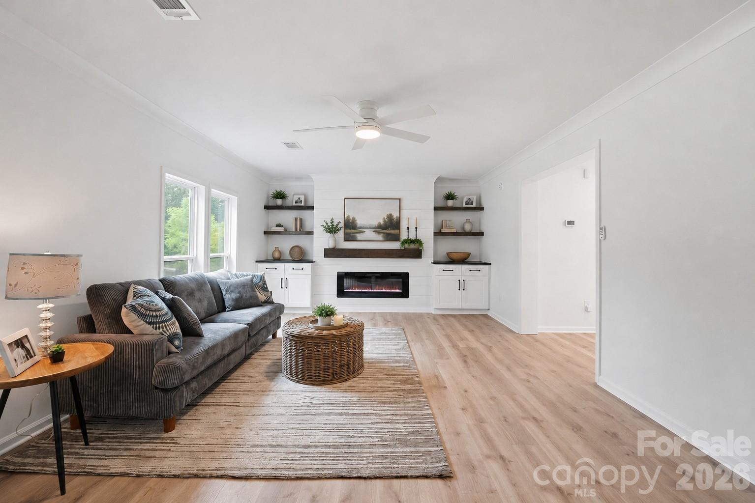 Beautiful feature wall with electric fire place and built-ins - 7553 Katherine Drive, Denver