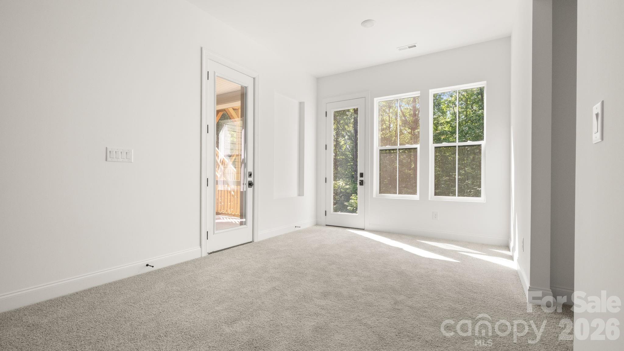 Living space leading to deck - 6774 Kingfisher Court, Denver