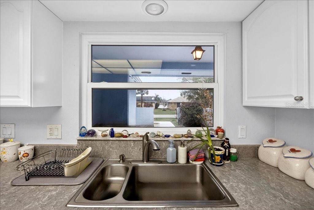 Enjoy the view of the water canal across  from your kitchen window! - 46 FLEMING CT, PALM COAST