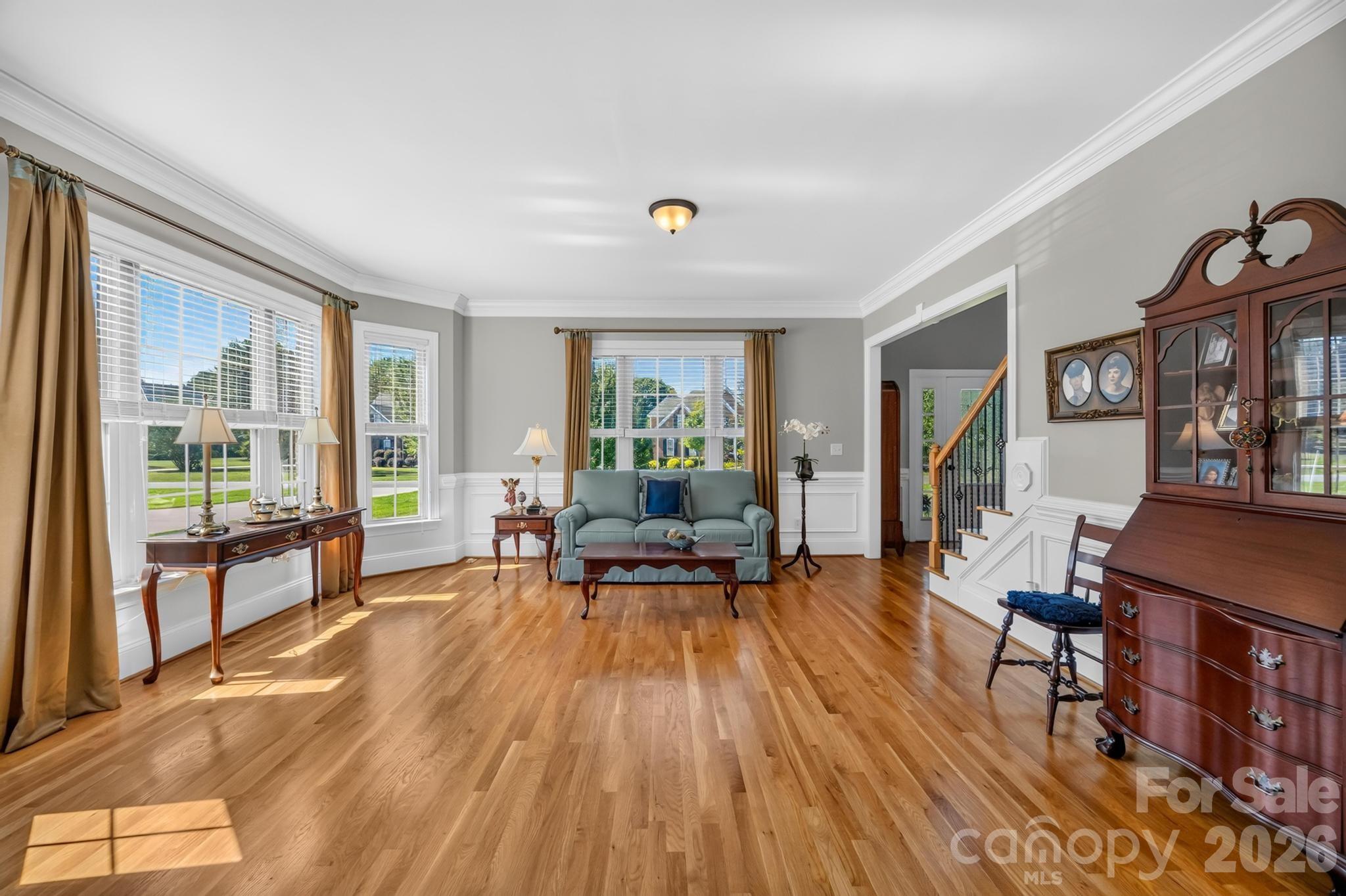 Sitting Area- natural lighting, crown molding, and wainscoting - 105 Mandarin Drive, Mooresville