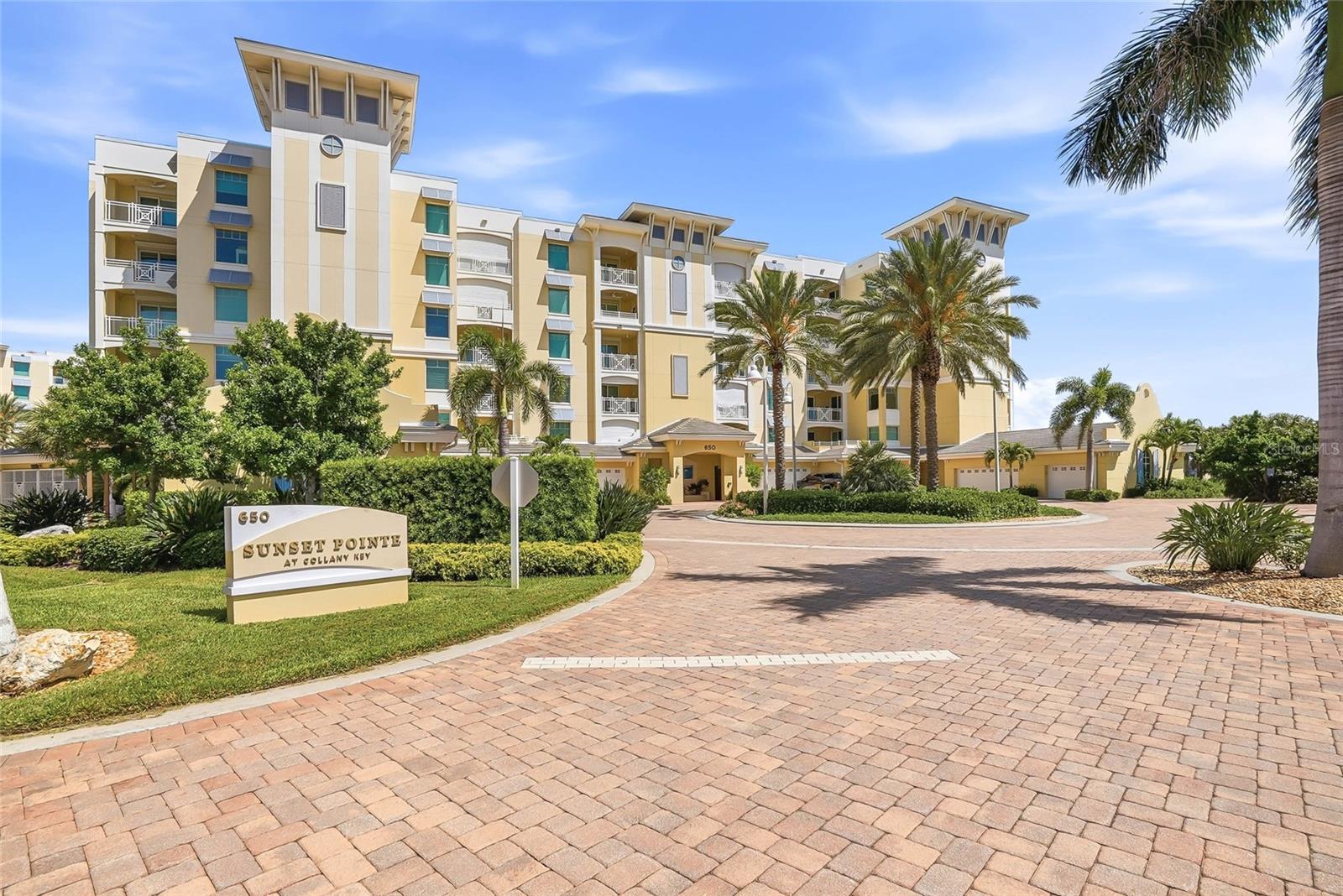 This is the front of the 650 Sunset Pointe building. Residence 401 is to the far left. End unit. 4th floor. - 650 COLLANY RD #401, TIERRA VERDE