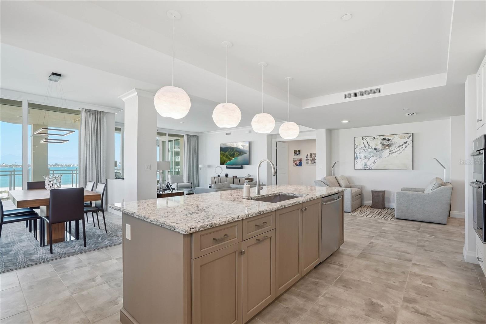 Kitchen island with seating and abundant prep space. - 650 COLLANY RD #401, TIERRA VERDE