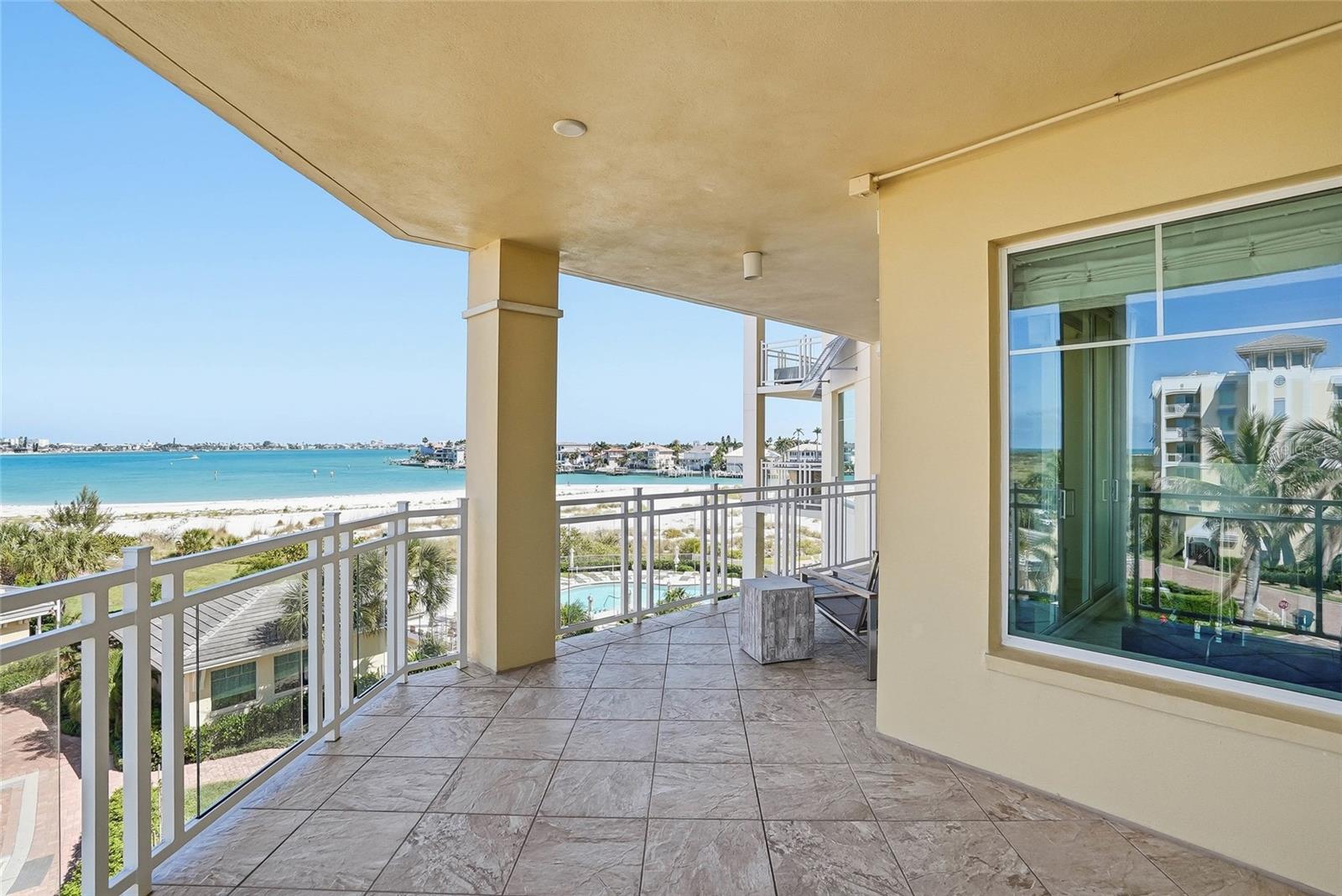Covered waterfront balcony ideal for relaxing and there is enough room for a dining al fresco experience! - 650 COLLANY RD #401, TIERRA VERDE