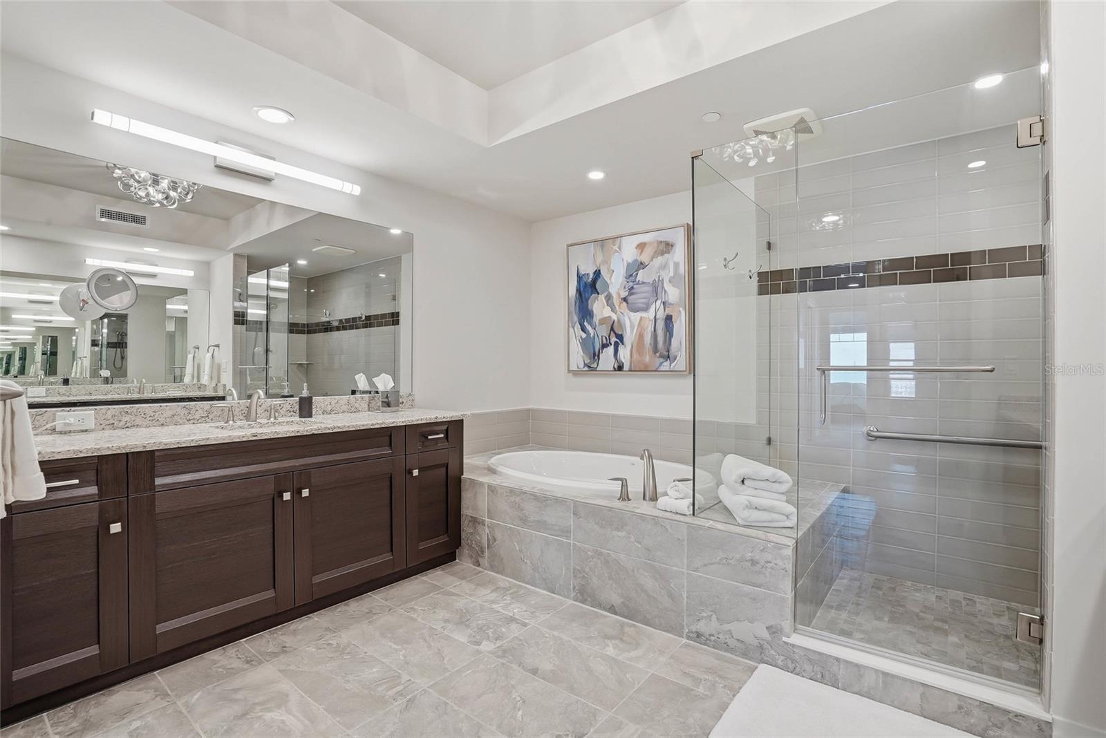 Spa-inspired primary ensuite bath. Large walk-in shower and soaking tub. - 650 COLLANY RD #401, TIERRA VERDE