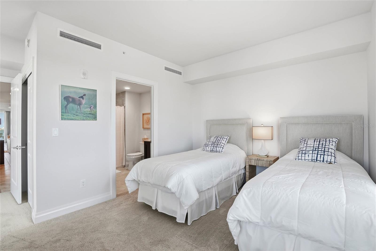 Bedroom #2 is arranged with twin beds, but a queen sized bed can easily fit and all bedrooms have ensuite bathrooms. - 650 COLLANY RD #401, TIERRA VERDE