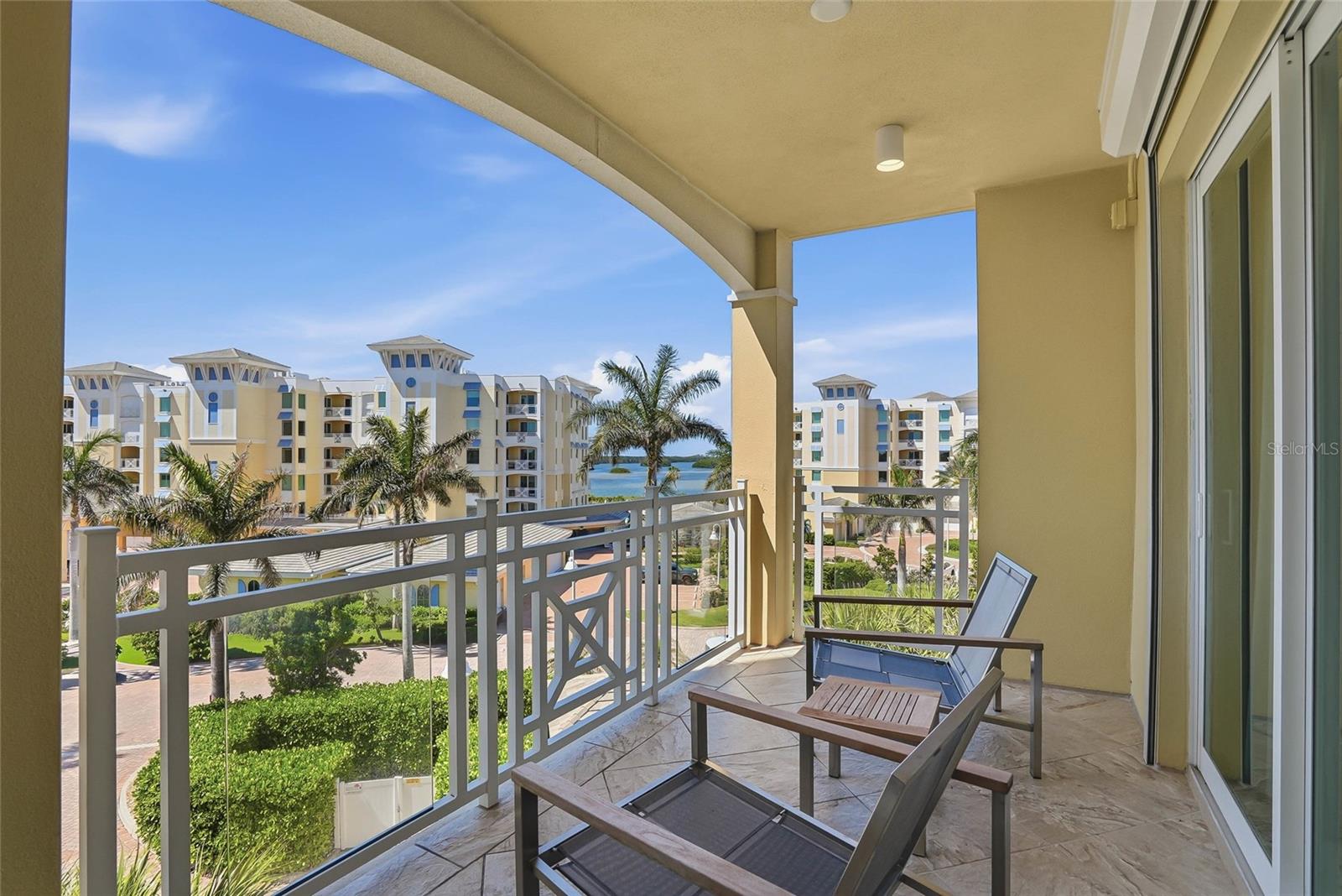 This is an outdoor view from the back balcony. It is a nice surprise to have this second balcony for cross ventilation. - 650 COLLANY RD #401, TIERRA VERDE