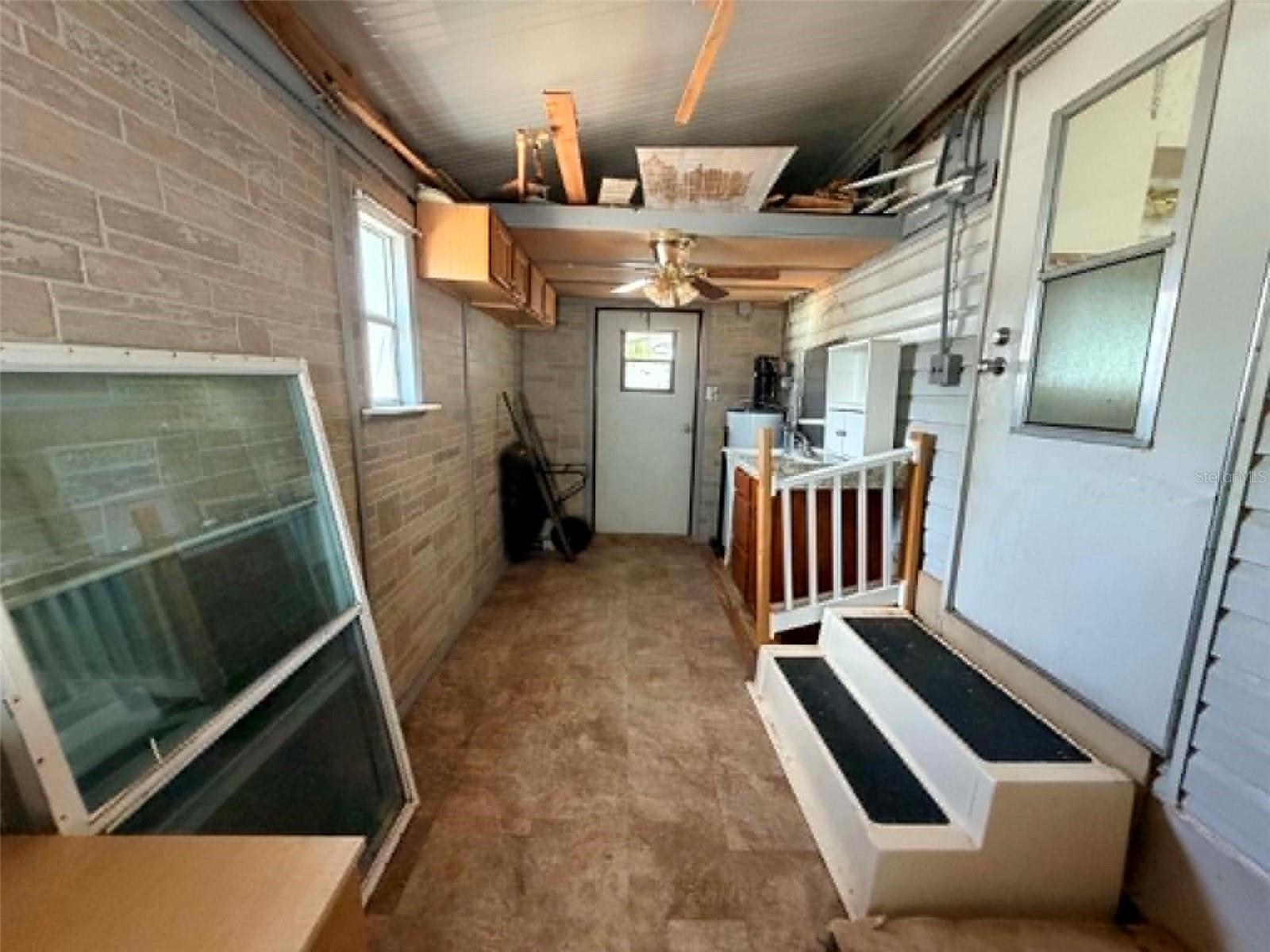 Utility room off of primary bedroom and side of house - 50989 HIGHWAY 27 #87, DAVENPORT